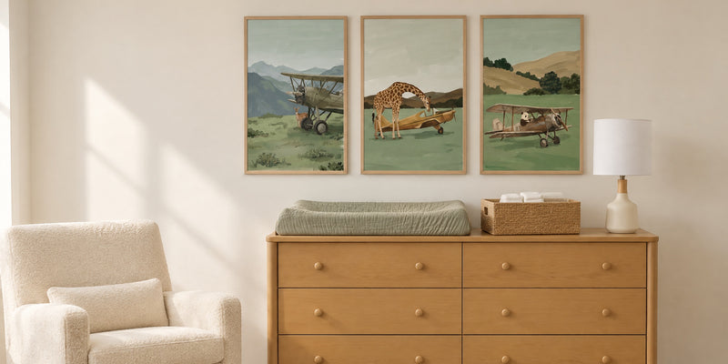 Vintage airplane nursery: changing table with three sage airplane prints above it