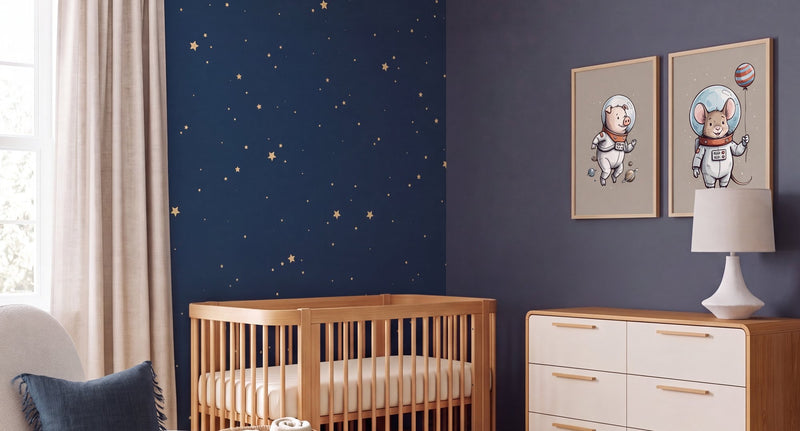 Grown-up space nursery banner: deep navy walls, a removable starry-sky wall behind a natural-wood crib, and a warm-neutral astronaut-animal art set over the dresser