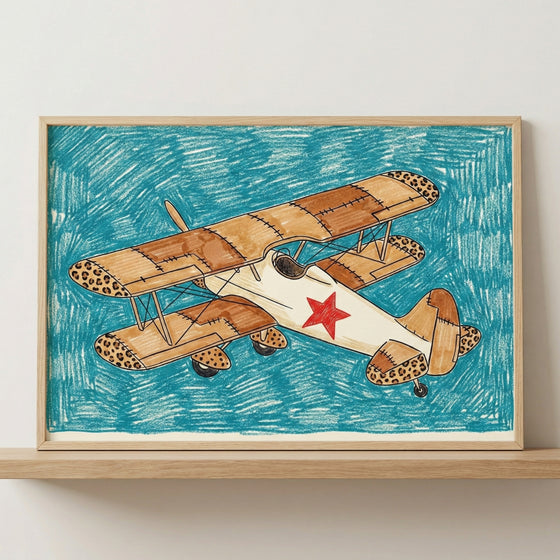Framed biplane aircraft wall art with a leopard-print airplane design, presented in a light wood frame sitting on a wooden shelf against a neutral wall.