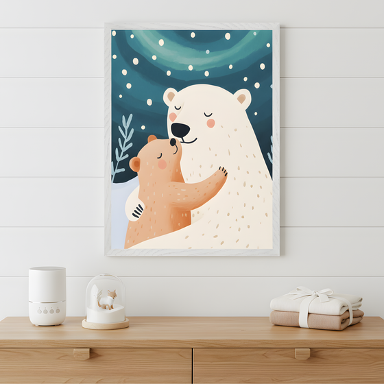 Framed nursery art of a warm embrace between a polar bear and a brown bear cub, set against a snowy night sky with falling snowflakes and swirling auroras. The bears have peaceful expressions, creating a cozy, loving vibe. The light wood dresser below is styled with folded baby clothes, a white diffuser, and a snow globe featuring a tiny fox.