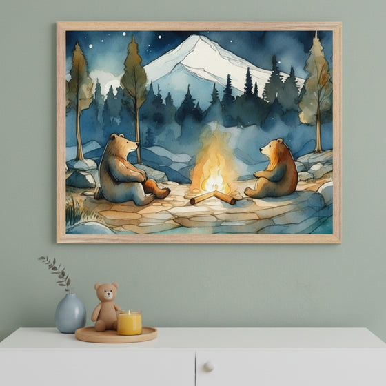 Framed artwork of two bears by a campfire with a mountain in the background, displayed on a wall.