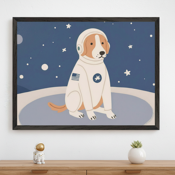 Modern room with a light wood dresser. A large black-framed print of a cartoon dog in an astronaut suit on a starry blue background hangs above the dresser. A small gold astronaut figurine and a succulent plant sit on the dresser.