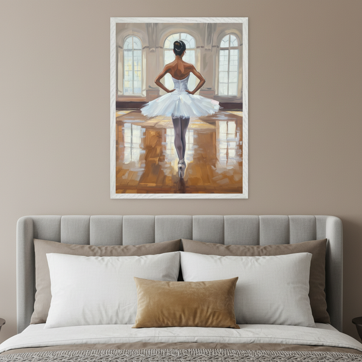 Modern bedroom with a grey upholstered bed. A large framed painterly artwork of a ballerina in a white tutu, seen from the back, standing en pointe in a room with arched windows, hangs centered above the bed.