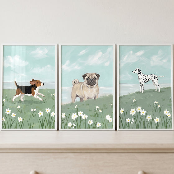 A running beagle, pug, and dalmatian in a blooming daisy field dogs wall art set of 3.