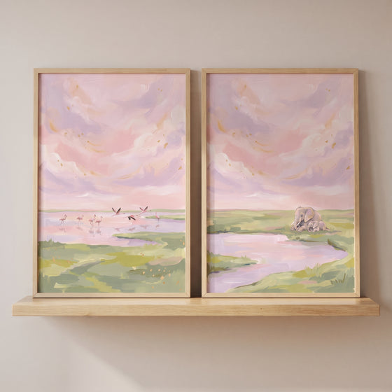 Blush pink sky safari animals artwork set of 2 featuring flamingos and elephants displayed on a light wood shelf.