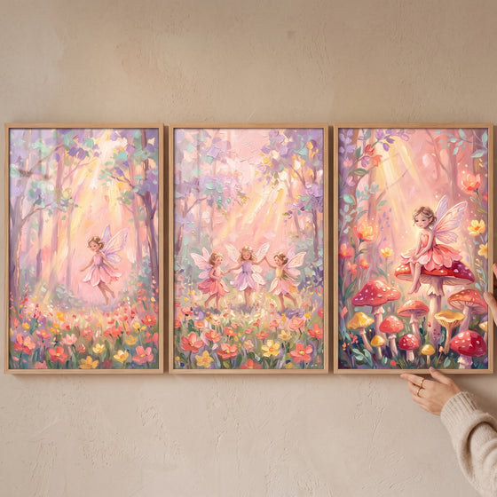 Blush wildflower woodland fairy wall art set of 3 with fairies flying, dancing, and sitting among forest mushrooms.
