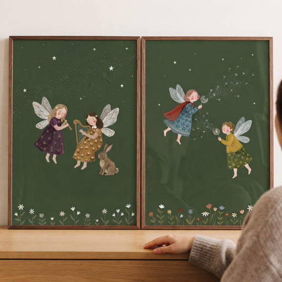 Celestial dark green fairies wall art set of 2 with fairies playing music near a rabbit and blowing dandelions.