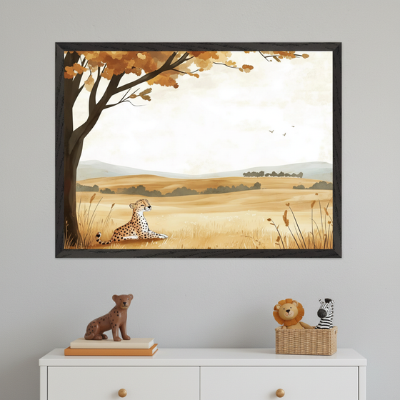 Framed wall art of a cheetah resting under a tree in a golden savanna landscape with rolling hills, soft skies, and distant birds flying. The image hangs above a white dresser topped with plush animal toys and a spotted figurine, giving the space a cozy, safari-themed nursery vibe.