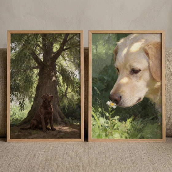 Dappled sunlight nature labrador wall art set of 2 shows a brown dog under a tree and a yellow dog sniffing a flower.