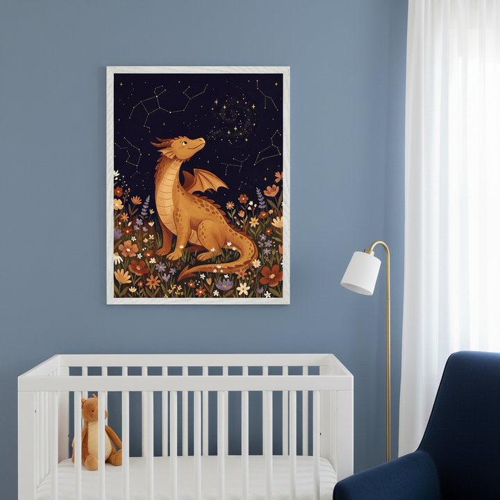 Modern nursery with a white crib. A large framed whimsical illustration of a brown dragon amidst wildflowers gazing at stars and constellations in a dark night sky hangs above the crib. A blue armchair and gold floor lamp are to the right.