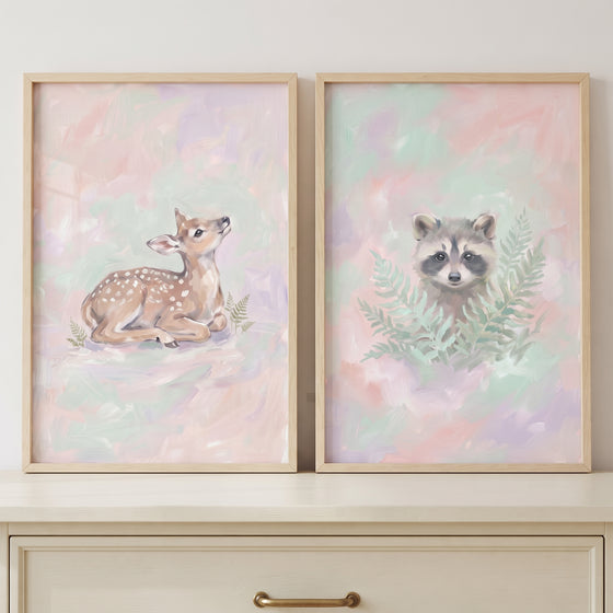 Dreamy impressionist forest animal wall art set of 2 featuring a fawn and a raccoon in soft pastel colors.