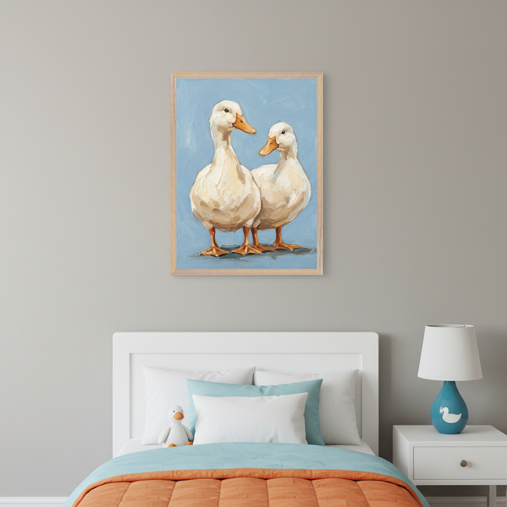 Kid's bedroom with a white bed, blue and orange bedding, and a white nightstand with a duck lamp. Above the bed, a framed painting depicts two white ducks with textured brushstrokes on a light blue background.