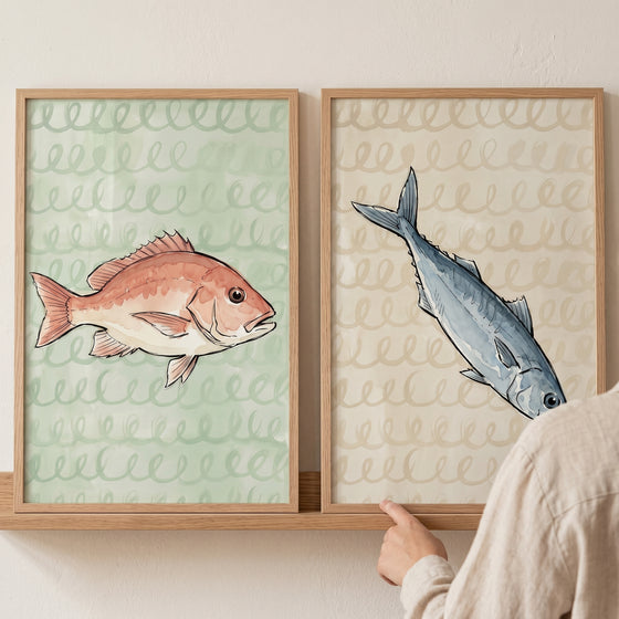 Pink and blue fish on patterned backgrounds in an earthy tone watercolor fish wall art set of 2.