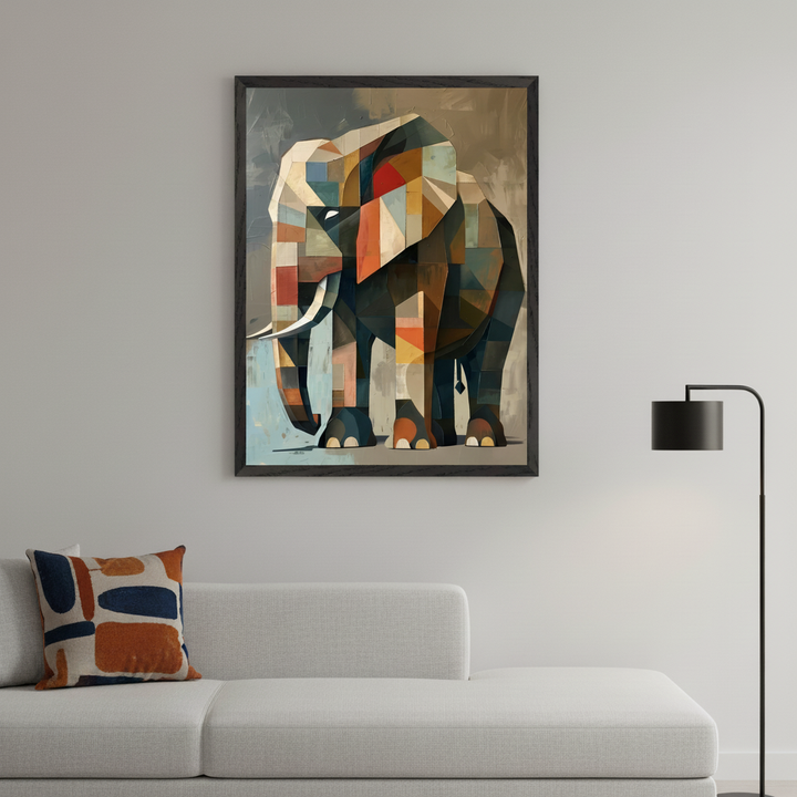 Modern living room with a light grey sectional sofa and a patterned throw pillow. A large black-framed abstract geometric elephant painting in brown, orange, blue, and red hangs above the sofa. A black floor lamp is on the right.