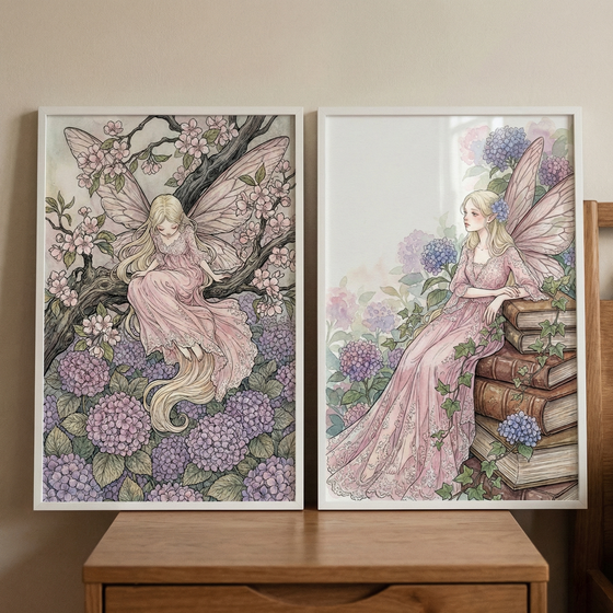 Two vertical framed illustrations hang side-by-side on a plain, neutral-toned wall. Both pieces feature a whimsical fairy with long, flowing blonde hair and large, delicate pink wings. In the left illustration, the fairy sits on a thick, dark tree branch adorned with small pink blossoms. Below her is a lush bed of clustered purple and pink hydrangeas. She wears a soft, layered pink gown that flows down toward the flowers.
