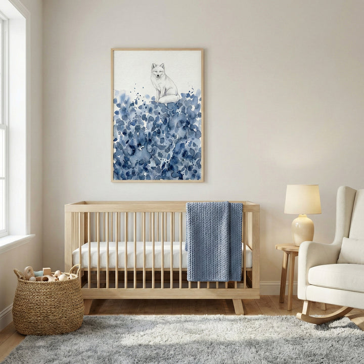 Close-up of a framed watercolor illustration of a fox with closed eyes, perched on a bed of loose, inky blue shapes. The soft palette and minimal design highlight the animal’s gentle expression and cozy charm.