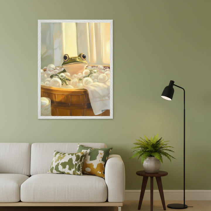 Modern living room with a white sofa against a green wall. A large framed illustration of a cartoon frog in a bubble bath hangs above the left side of the sofa.