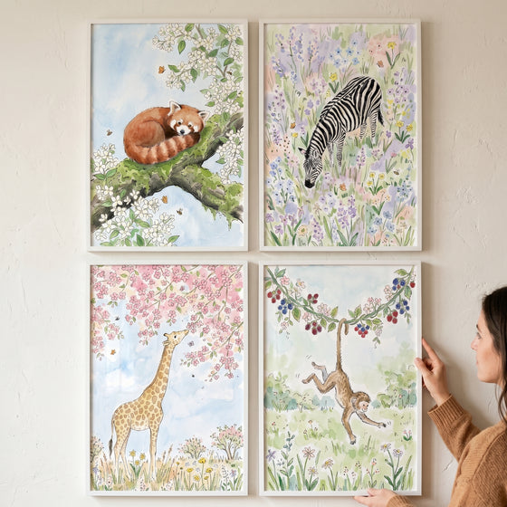 Gentle floral safari animal wall art set of 4 featuring watercolor red panda, zebra, giraffe, and monkey illustrations.