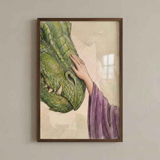 A framed illustration featuring a close-up of a green, scaly dragon's head. A slender hand, emerging from a textured purple sleeve, reaches out to gently touch the creature's snout. The artwork utilizes a watercolor and colored pencil style, with delicate washes of color and visible linework on a neutral background. The piece is mounted in a dark wooden frame and displayed against a plain, light-colored wall.