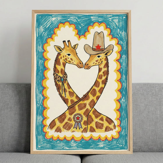 Framed illustration of two giraffes with intertwined necks, one wearing a cowboy hat with a red star and a ribbon on its chest, the other in a bolo tie. The artwork has a playful, western theme with a crayon-like blue and yellow scalloped border.