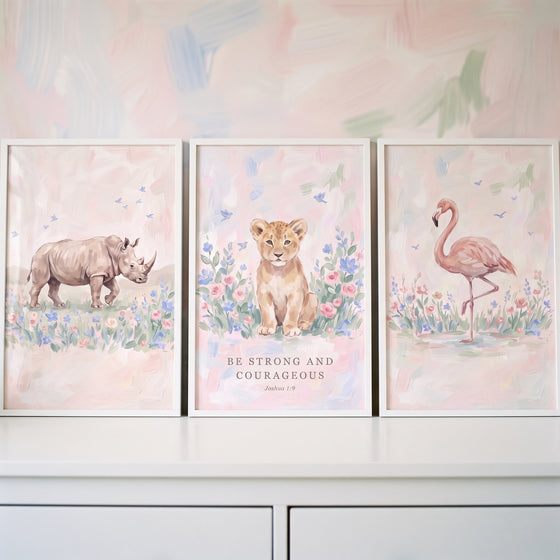 Graceful floral safari animals artwork set of 3 features a rhino, lion cub with scripture, and flamingo in soft pastels.