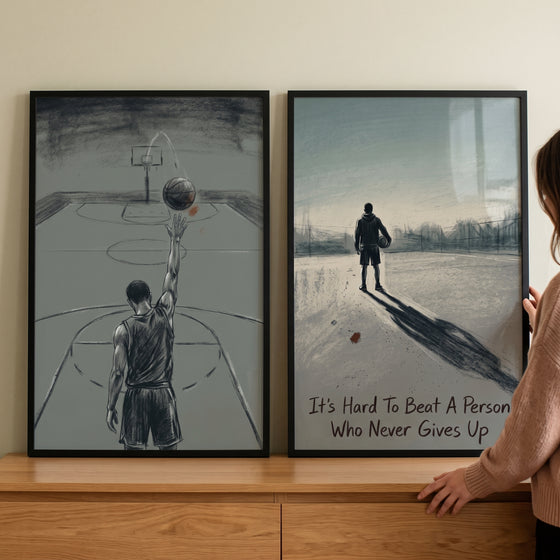 Industrial charcoal basketball player sports wall art set of 2 shows framed sketches of athletes atop a wooden cabinet.