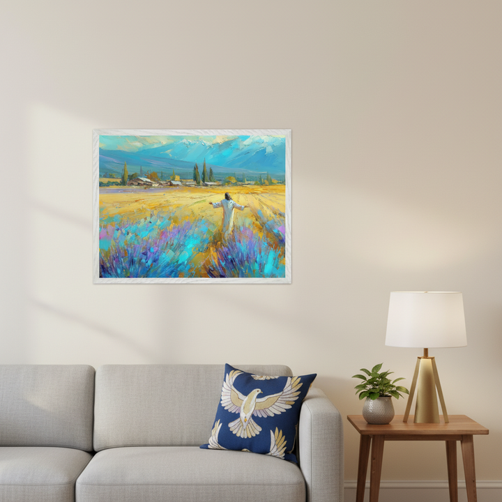 Modern living room with a grey sofa and a wooden side table. A framed impressionistic painting of a person in a lavender field with mountains and a village hangs above the sofa.