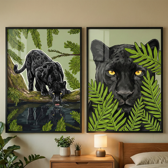 Two framed vertical graphic illustrations hang side-by-side on a light-colored wall above a wooden nightstand. The left piece features a full-bodied black leopard with subtle spots, crouched on a mossy branch while drinking from a pool of water that shows its reflection. The right artwork is a close-up portrait of the big cat’s head with striking yellow eyes, partially hidden behind lush green fern leaves. Below the art, a small lamp and two potted plants sit on a wooden table next to a bed.