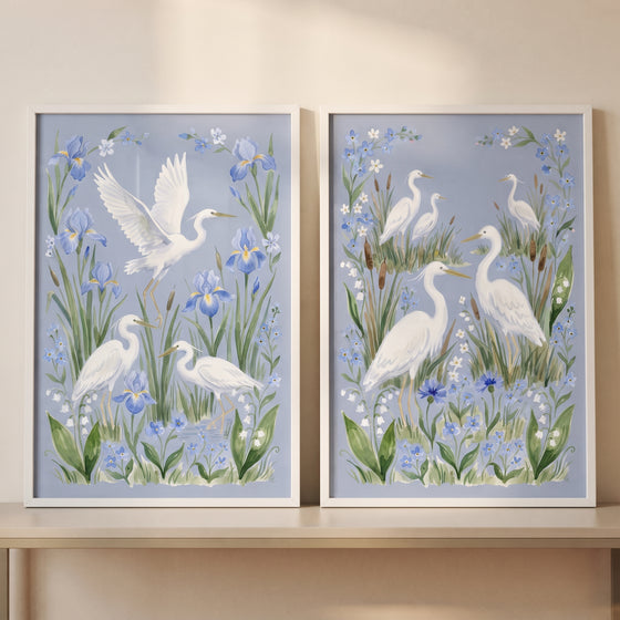 Meadow wildflower white egret bird wall art set of 2 features white egrets among blue irises and green foliage.