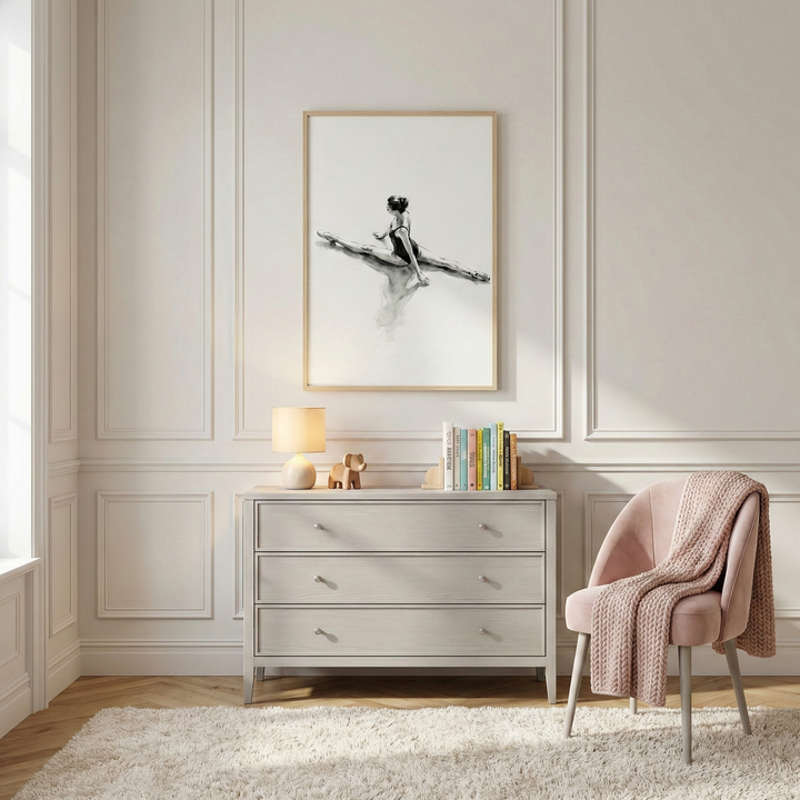 This elegant interior features a serene and minimalist design. The focal point is a large, vertical wooden-framed artwork depicting a graceful ballerina in a black-and-white sketch, frozen in a wide-seated split against a minimalist white background.