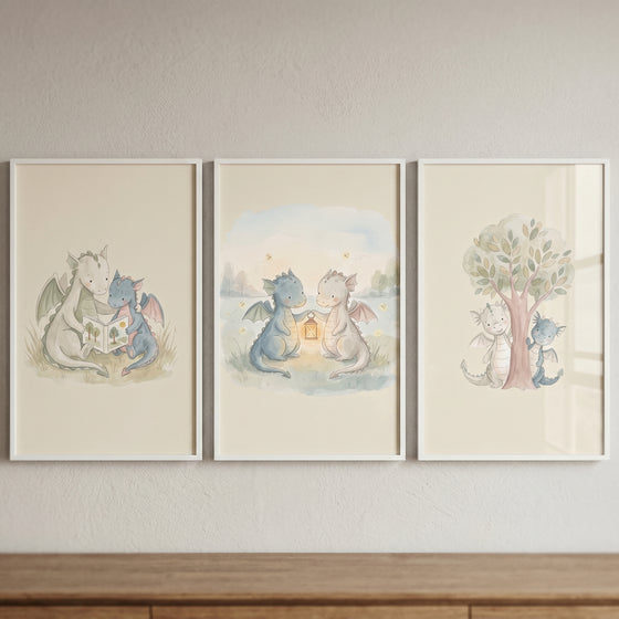 Minimalist boho baby dragons wall art set of 3 depicting two dragons reading, holding a lantern, and playing by a tree.