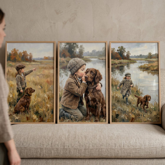 Moody autumn girl dog wall art set of 3 on a beige sofa, featuring a child and brown dog in rustic nature scenes.