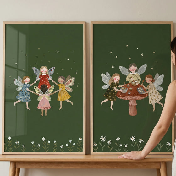 Moody green forest fairies wall art set of 2 shows whimsical sprites dancing and baking on a mushroom under a starry sky.