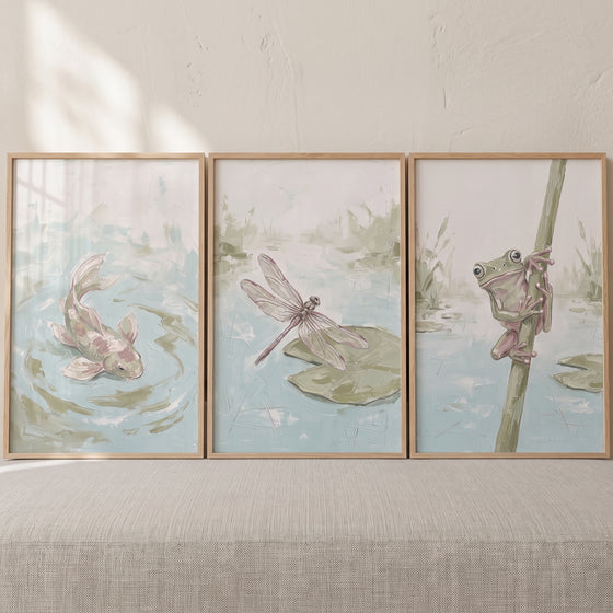 Mossy green pond wall art set of 3 depicting a swimming fish, a dragonfly on a lily pad, and a frog on a reed.