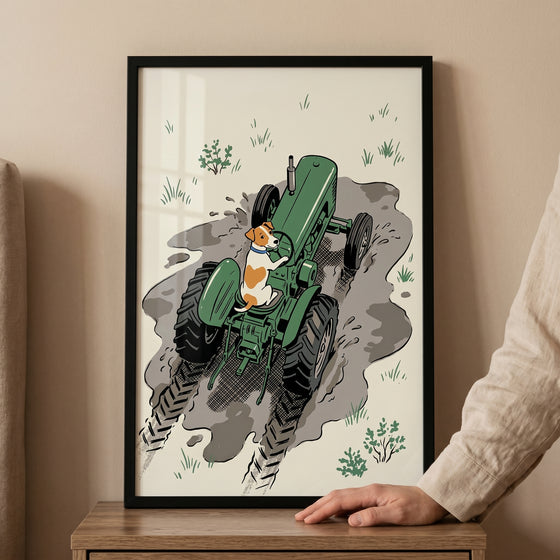 Framed muddy green tractor dog wall art of a small dog driving a green tractor through a muddy field with tire tracks.