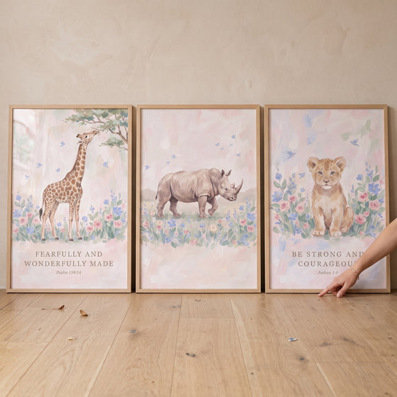 Muted pastel safari animals wall art set of 3 featuring a giraffe, rhino, and lion cub with biblical text.