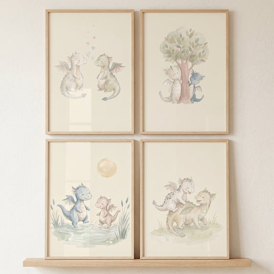 Muted tones baby dragons print set of 4, featuring whimsical pairs of dragons in outdoor scenes within light wood frames.