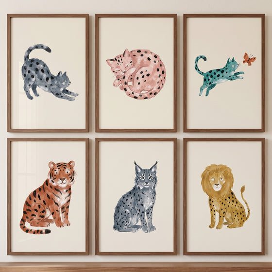 Neutral watercolor wild cat wall art set of 6 featuring framed tiger, lion, lynx, and spotted cat illustrations.