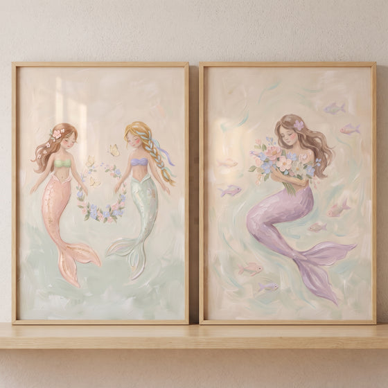 Ocean garden pastel mermaid wall art set of 2 featuring whimsical mermaids with flowers, wreaths, and swimming fish.