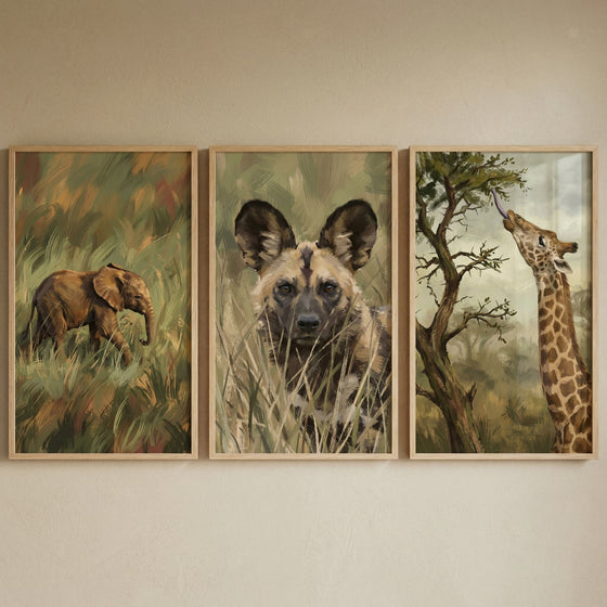 Painterly earthy safari animal wall art set of 3 featuring a baby elephant, an African wild dog, and a giraffe.