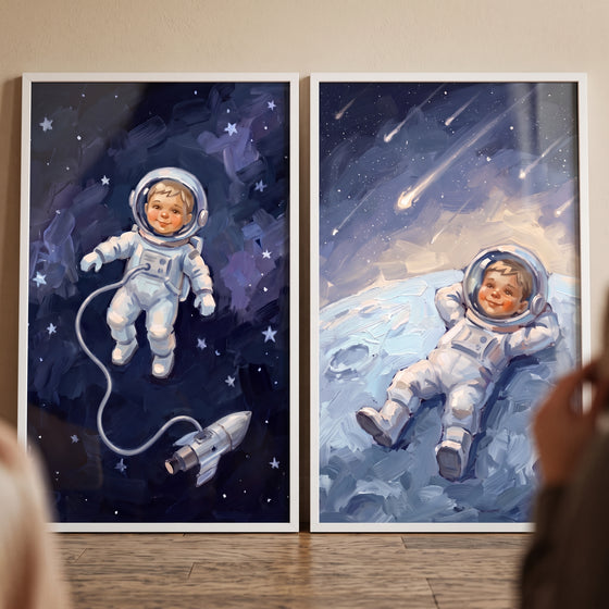 Painterly night baby astronaut wall art set of 2 featuring an infant floating in space and reclining on the moon.