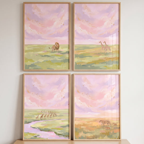 Lions and giraffes beneath pastel clouds are featured in this painterly pink savanna animals wall art set of 4.