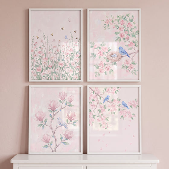 Pale pink floral garden wall art set of 4 depicting blossoms, bluebirds, and honeybees in minimalist white frames.