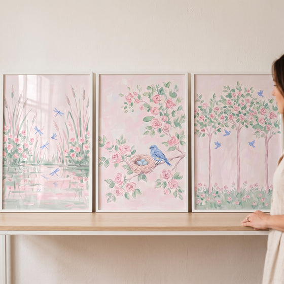 Pastel floral pink garden wall art set of 3 featuring dragonflies, a bird nest, and trees in soft watercolor tones.