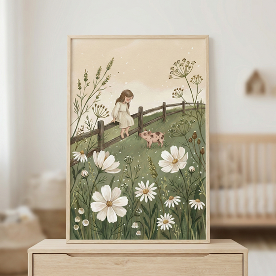 A framed illustration shows a young girl with long brown hair sitting on a wooden fence in a lush meadow. She wears a white dress and looks down at a small spotted piglet. Large white flowers and tall grasses fill the foreground against a muted green landscape. The style is soft and whimsical, using a palette of earthy tones and whites. The piece is set in a light wood frame and displayed on a dresser in a softly lit, neutral-toned room.