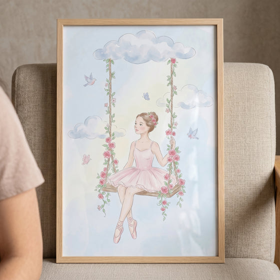 Framed pink rose swing ballerina wall art shows a dancer on a floral swing among clouds, birds, and butterflies.