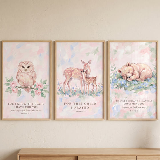 Pink scripture forest animals wall art set of 3 with an owl, deer, and bear cub featuring verses in light wooden frames.
