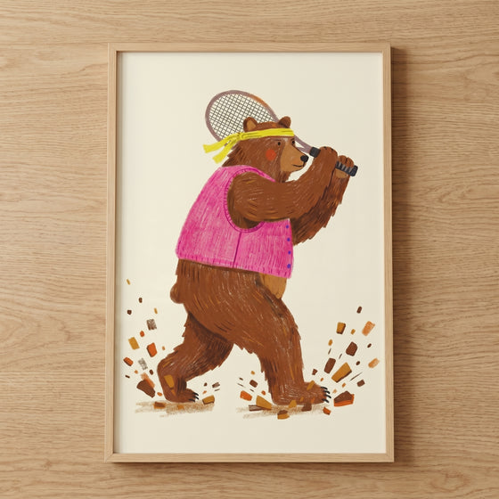 Pink vest tennis bear wall art features a brown bear with a yellow headband swinging a racket as dirt kicks up.