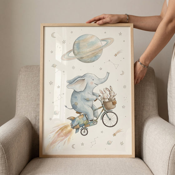 Rocket bicycle space animals wall art features an elephant and bunnies riding past a ringed planet and stars.