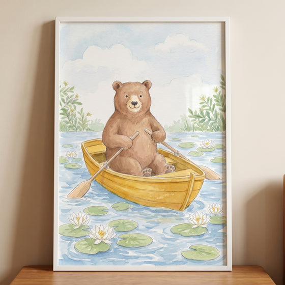 Rowing yellow boat bear wall art features a cute brown bear in a boat on a lily pond under a soft blue sky.